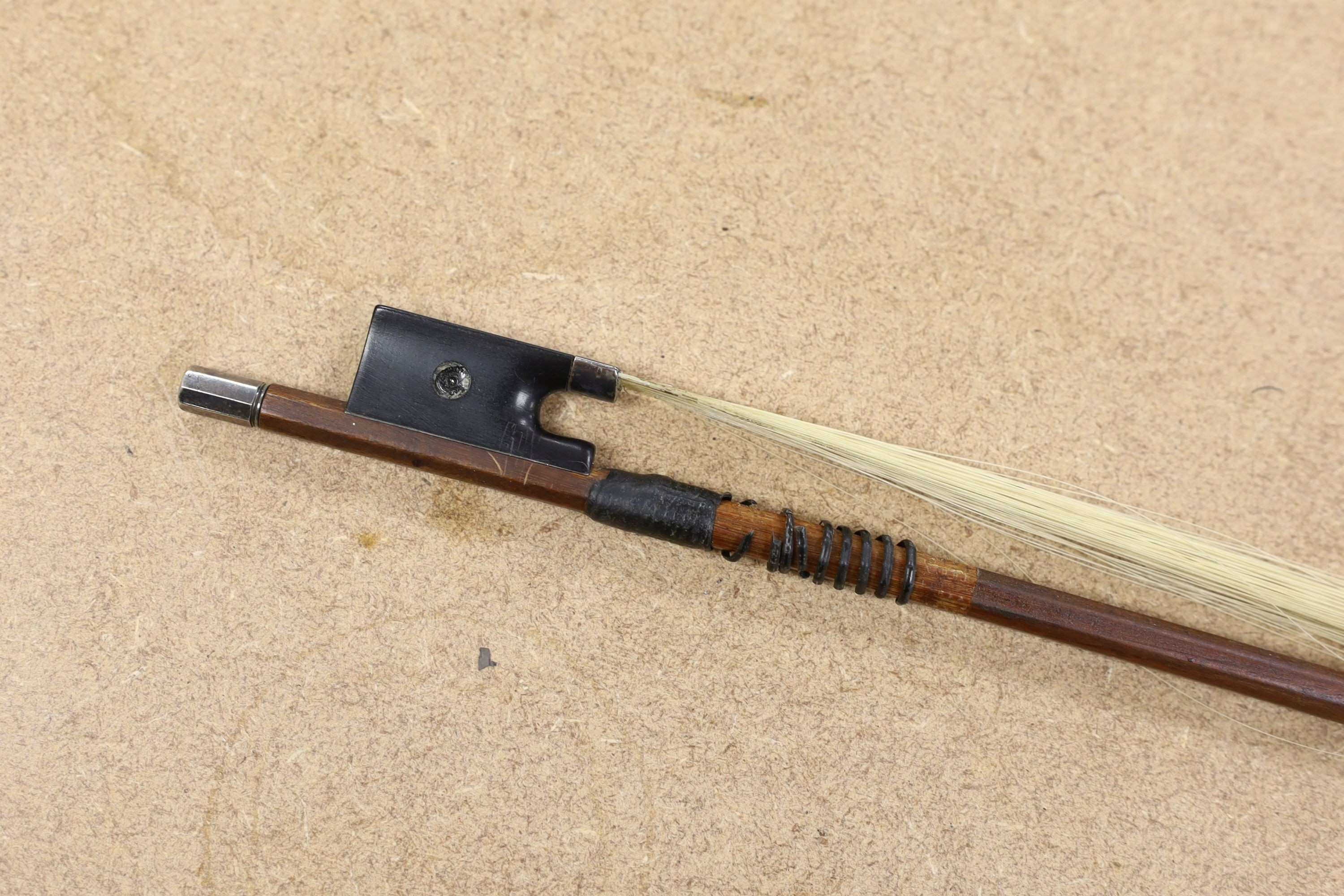 A 19th century violin with 14 inch 2 piece back, unlabelled, cased with silver mounted bow.